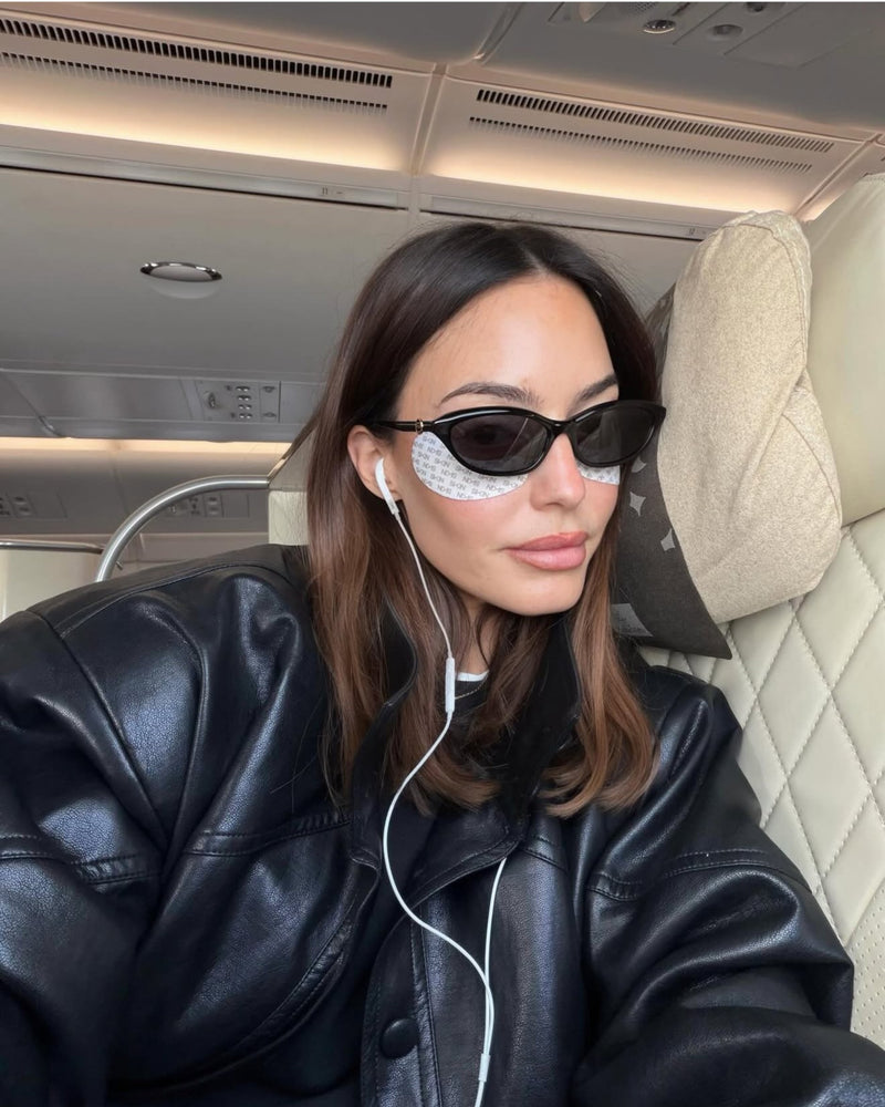 Wears her Leather Bomber Jacket for a cozy plane ride.