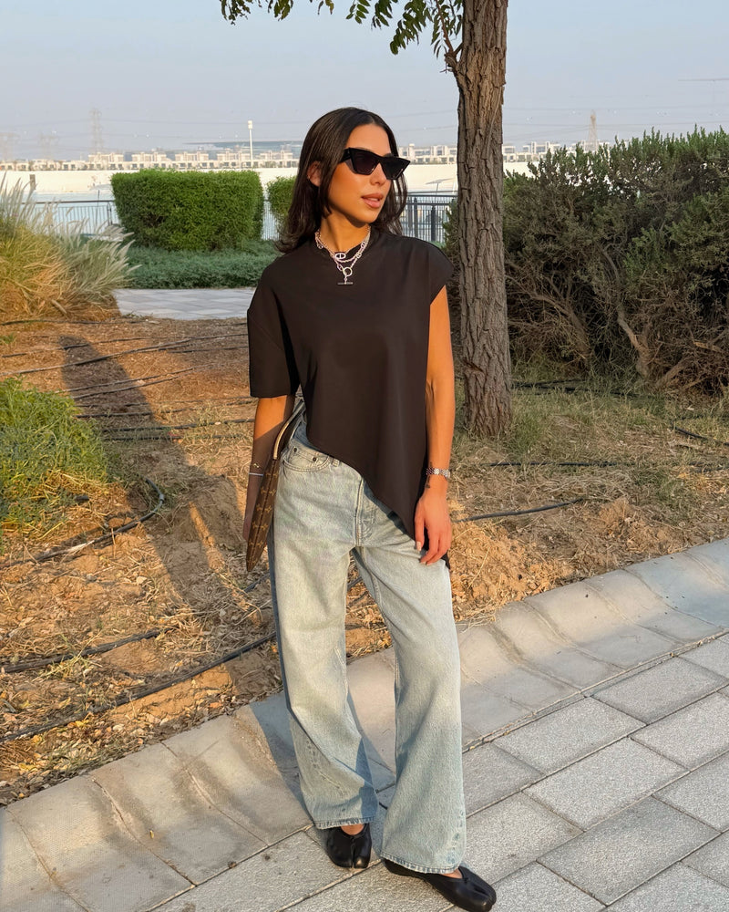 Styles her Twisted T-Shirt for a busy work day.