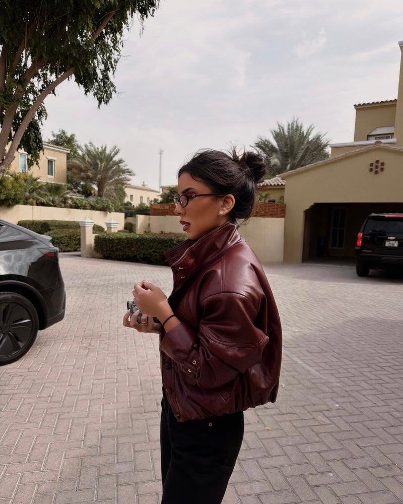 Styles her Leather Bomber in Burgundy out for lunch.
