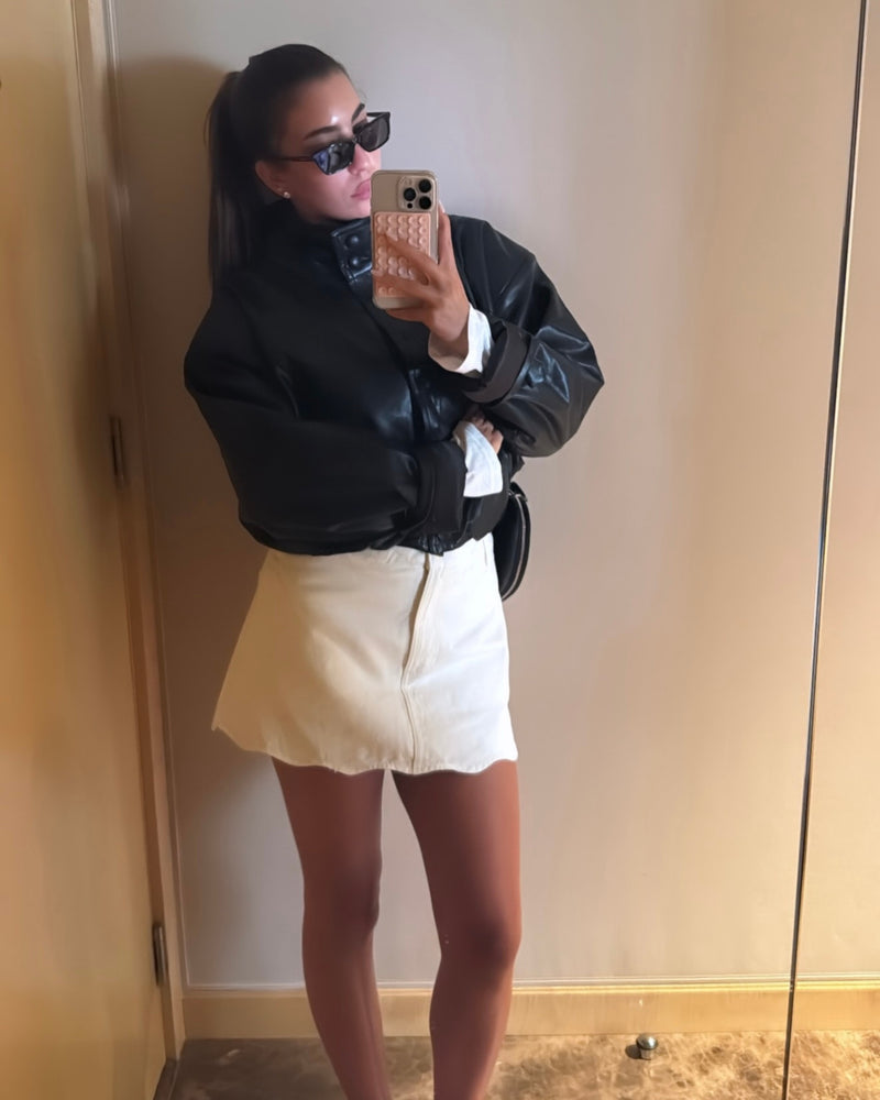 Styles her Leather Bomber for a busy day in London
